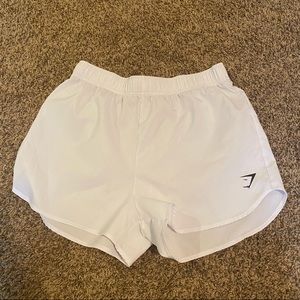 White gymshark loose training shorts